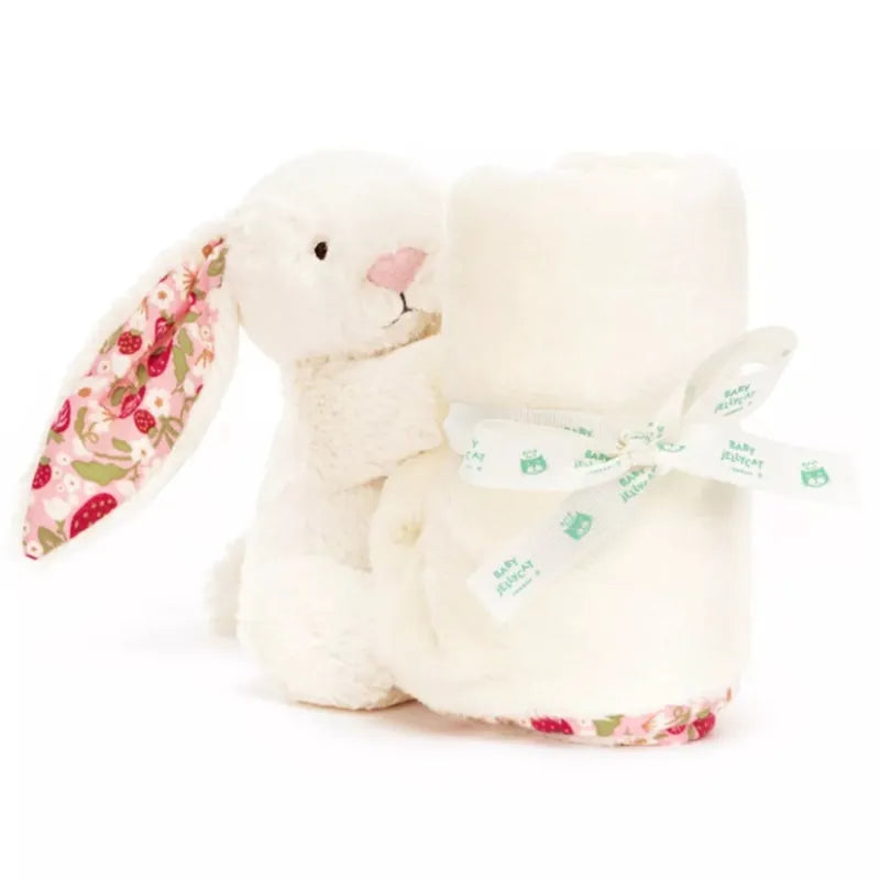 Jellycat Blossom Cream Bunny Berry Soother gift-ready — cream plush bunny with strawberry floral ears rolled with cream blanket and tied with Baby Jellycat ribbon