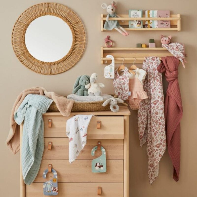 Jiggle & Giggle Juliet Muslin Wrap & Arrival Card in a room with other decor