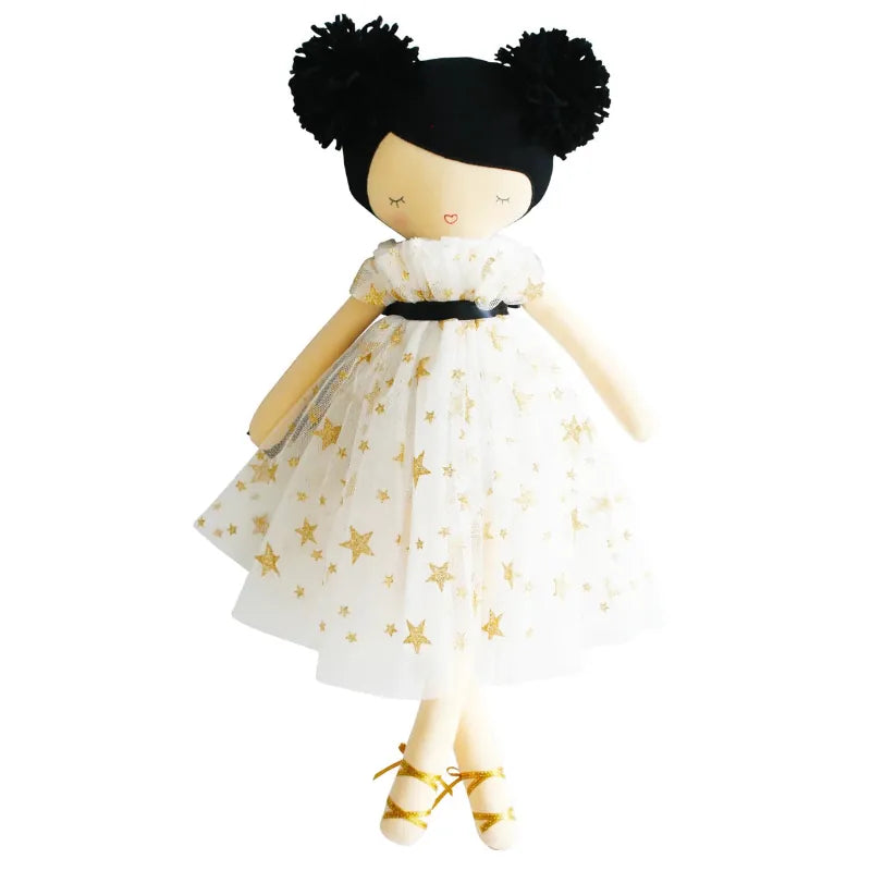 Doll with black hair styled in buns, wearing a white dress with gold stars on a white background