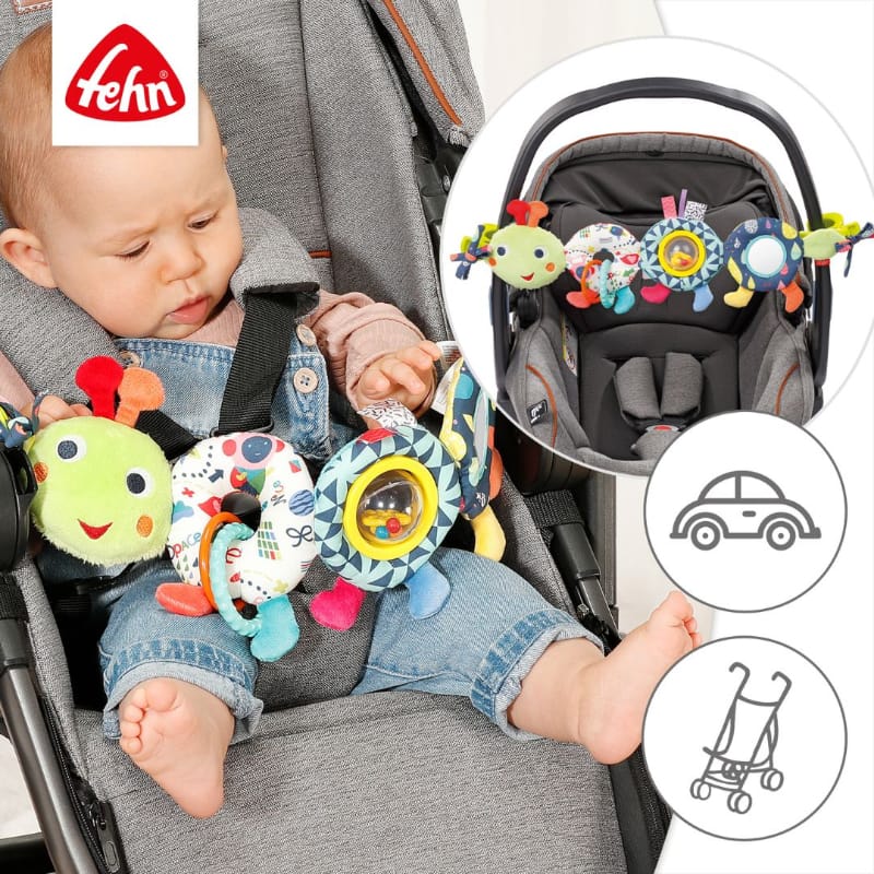 Baby in pram playing with Fehn Pram Chain Caterpillar — clips securely to prams and car seats; inset shows caterpillar attached to capsule handle