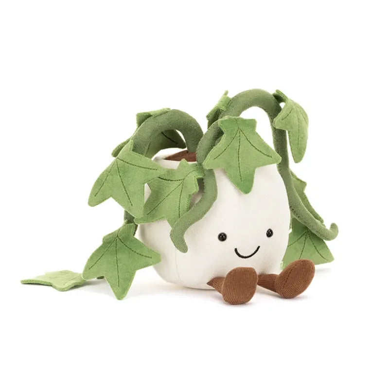 Jellycat Amuseables Ivy angled front view — white plush pot plant with embroidered smiling face, brown corduroy feet and multiple trailing green ivy vines with lobed leaves
