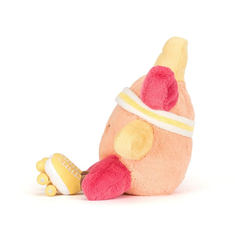 Jellycat Amuseables Sun Roller Skates side view — peach plush sun with yellow ray, hot pink arm, yellow striped headband and yellow roller skate with white laces and wheels