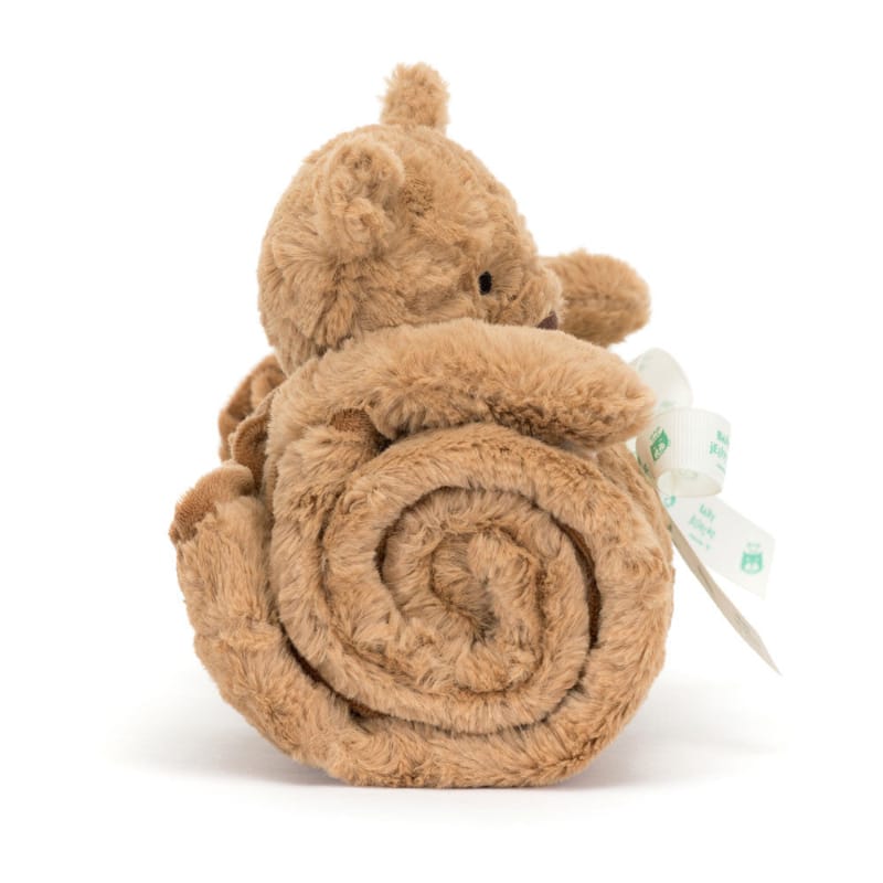 JJellycat Bartholomew Bear Blankie gift-ready — honey brown plush bear sitting atop rolled caramel security blanket tied with Baby Jellycat ribbon bow