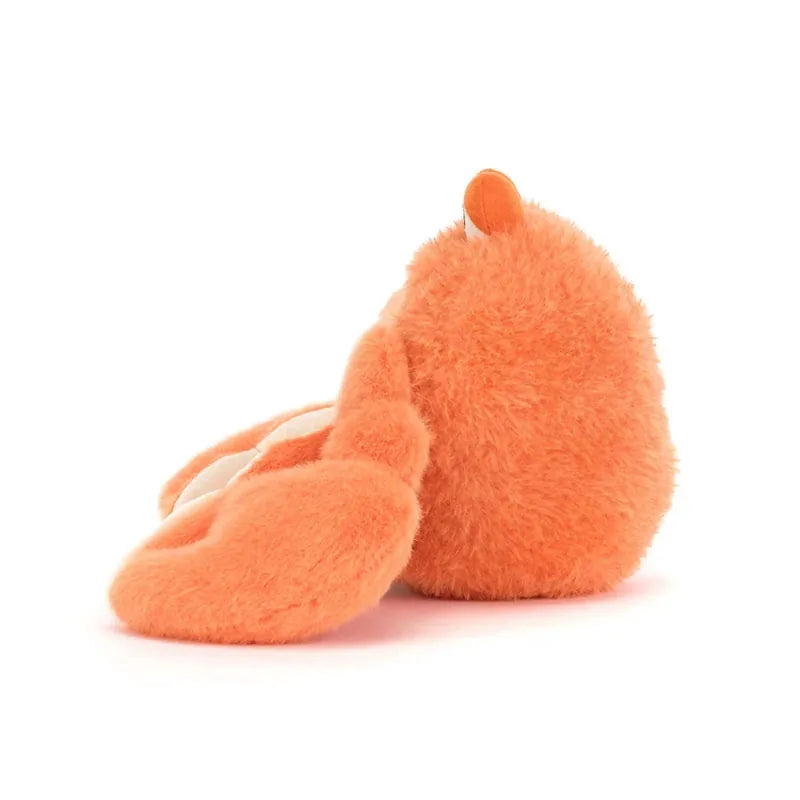 Jellycat Pinchsnap Crab side view — orange plush crab with raised claw, textured shell body and soft legs, showing profile